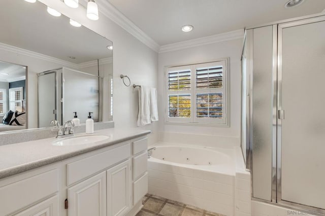 bathroom with ornamental molding, vanity, and separate shower and tub