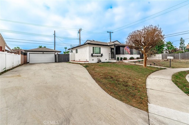 single story home with a garage and a front lawn