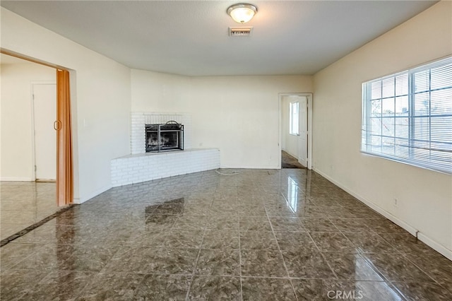 unfurnished living room with a fireplace