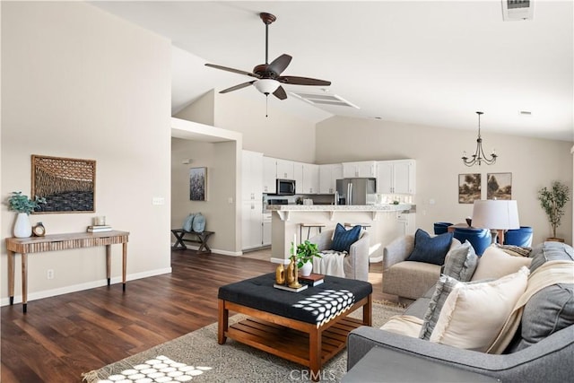 living room with dark wood-type flooring, high vaulted ceiling, and ceiling fan with notable chandelier