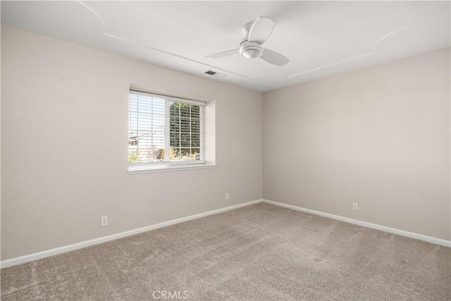 unfurnished room with ceiling fan and carpet flooring