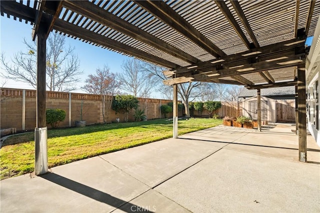 view of patio / terrace with a pergola and a shed