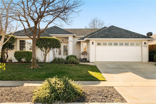 single story home featuring a garage and a front yard