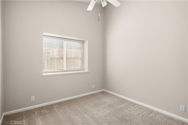 empty room featuring carpet floors and ceiling fan