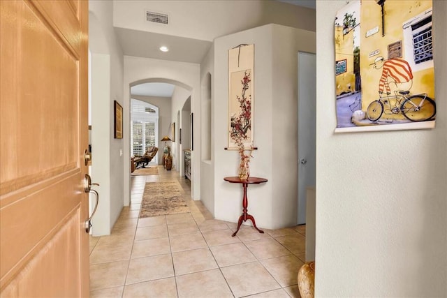 hallway with light tile patterned floors