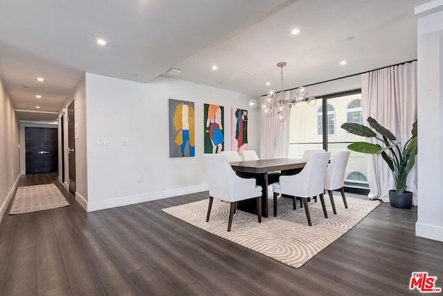 dining room featuring dark hardwood / wood-style flooring and a chandelier