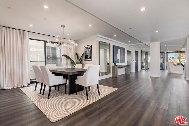 dining room with a notable chandelier and dark wood-type flooring