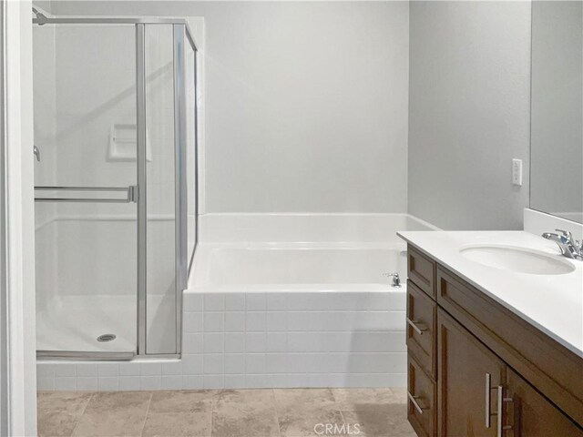 bathroom featuring vanity, tile patterned flooring, and independent shower and bath