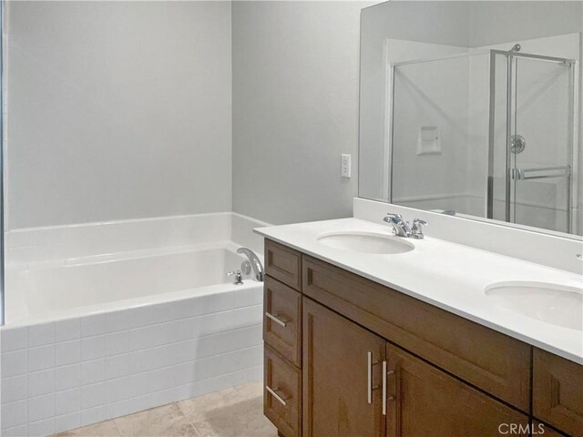 bathroom featuring vanity and plus walk in shower