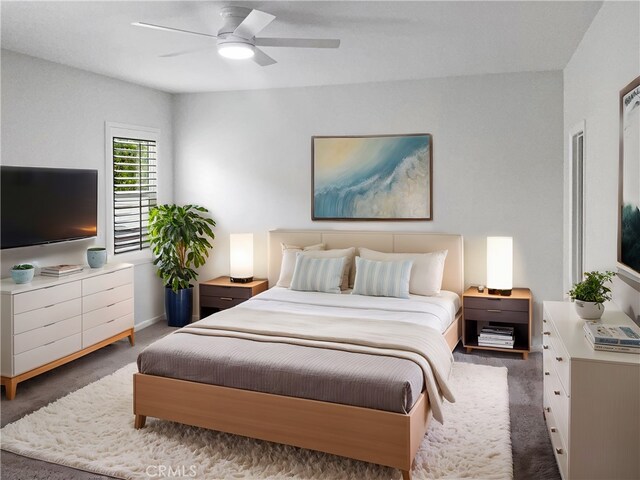 carpeted bedroom with ceiling fan