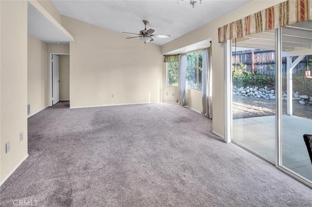 carpeted empty room with ceiling fan