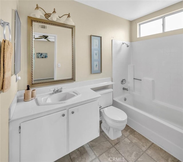 full bathroom featuring toilet, vanity, and shower / washtub combination