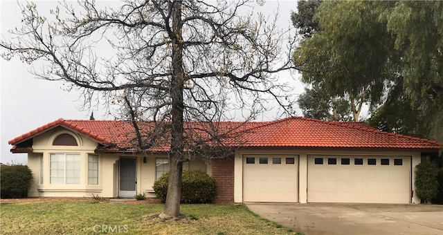 view of front facade with a garage and a front lawn