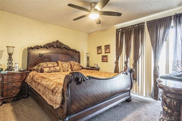 carpeted bedroom with multiple windows, a textured ceiling, and ceiling fan