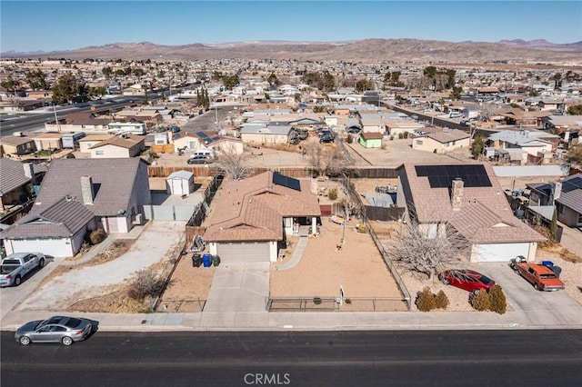 birds eye view of property featuring a mountain view