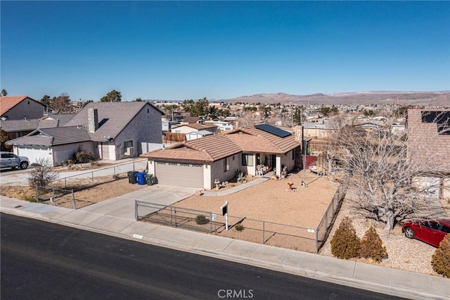 view of front of house featuring a mountain view and a garage