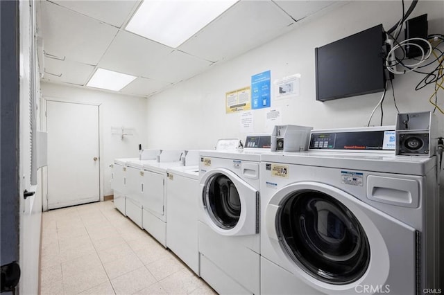 clothes washing area with independent washer and dryer