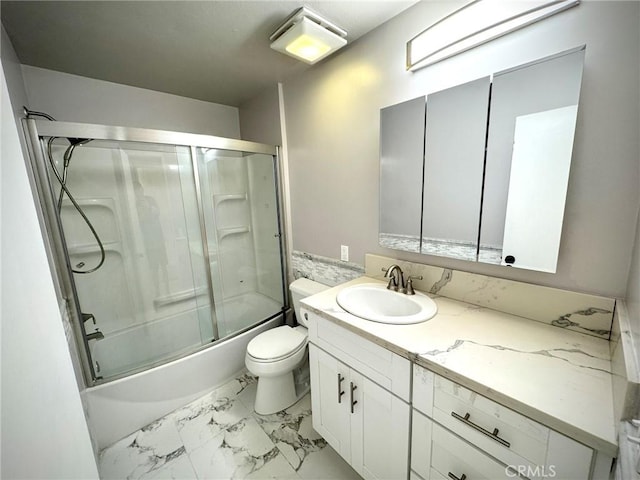 full bathroom with toilet, enclosed tub / shower combo, and vanity