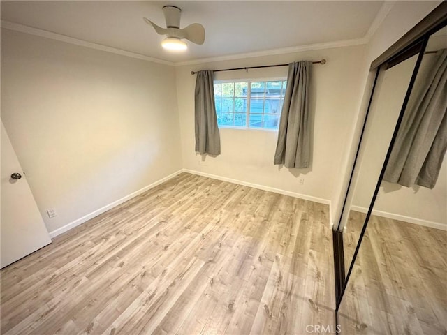 unfurnished bedroom featuring a closet, ceiling fan, ornamental molding, and light hardwood / wood-style floors