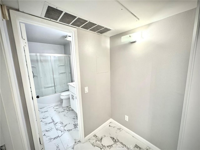 full bathroom featuring shower / bath combination with glass door, vanity, and toilet