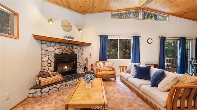 carpeted living room featuring wooden ceiling, lofted ceiling, and a stone fireplace