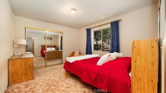 carpeted bedroom with a closet