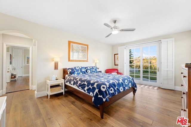 bedroom with light wood-type flooring, ceiling fan, and access to outside