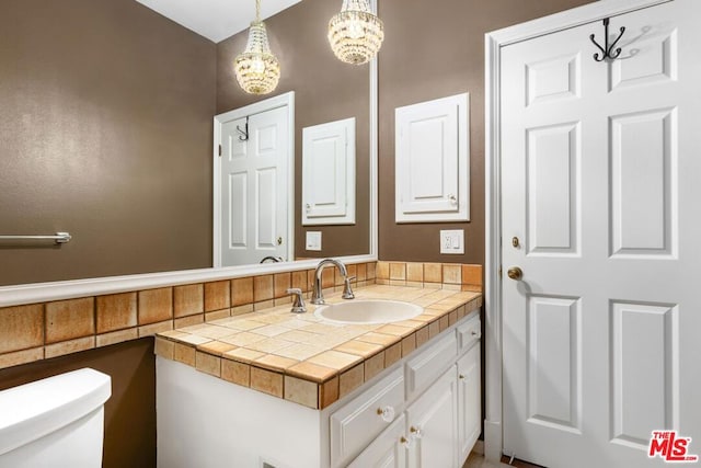 bathroom with toilet and vanity