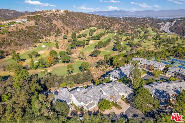 birds eye view of property with a mountain view