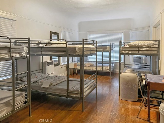 bedroom featuring cooling unit and hardwood / wood-style floors