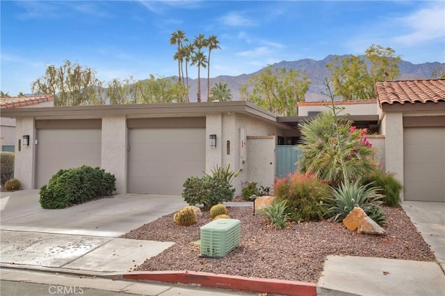 view of front of home featuring a mountain view and a garage