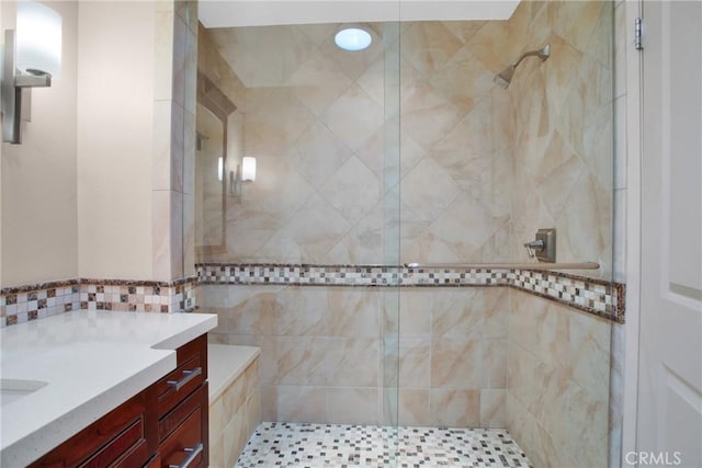 bathroom featuring vanity and a tile shower