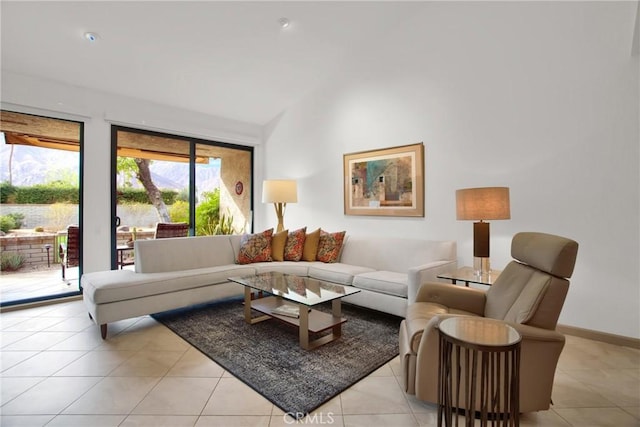 tiled living room with lofted ceiling