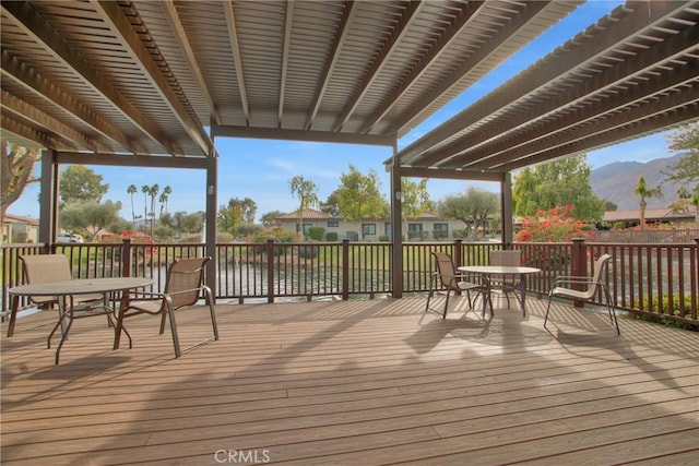 wooden terrace featuring a pergola and a mountain view