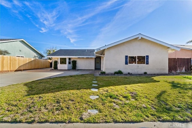 ranch-style home with a front lawn