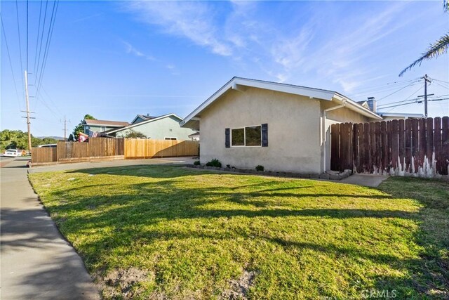 view of property exterior featuring a yard