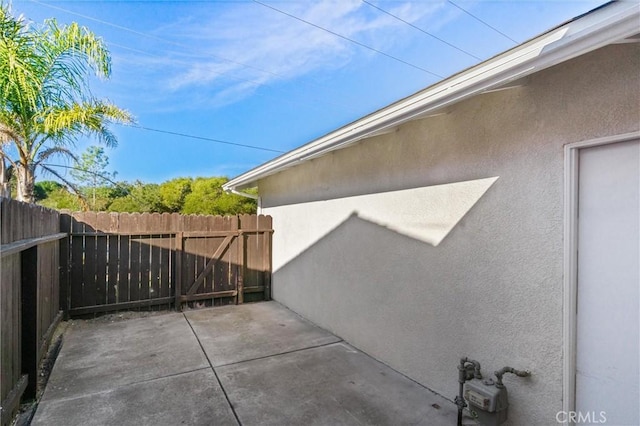 view of side of property featuring a patio