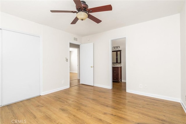 unfurnished bedroom with a closet, ceiling fan, and light hardwood / wood-style flooring