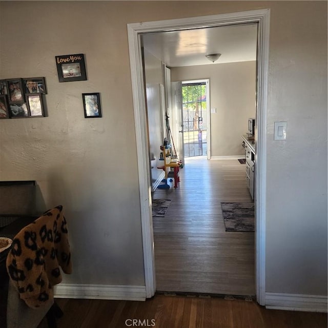 hall with hardwood / wood-style floors