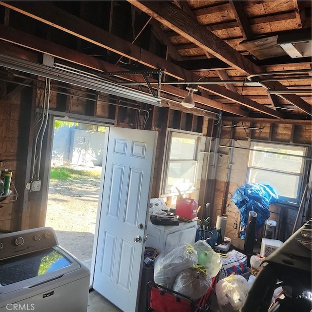 miscellaneous room featuring washer / dryer and concrete floors