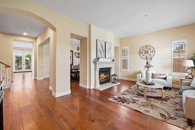 living room with a healthy amount of sunlight and hardwood / wood-style floors