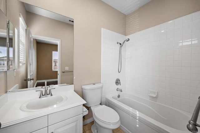 full bathroom featuring vanity, toilet, and washtub / shower combination