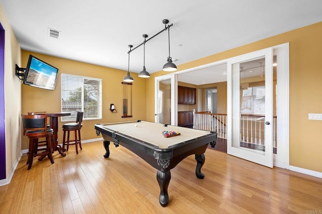 game room with billiards and light hardwood / wood-style floors