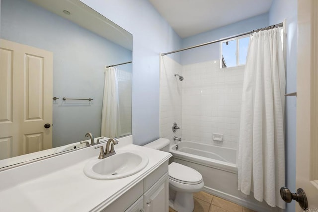 full bathroom with shower / tub combo, vanity, tile patterned flooring, and toilet