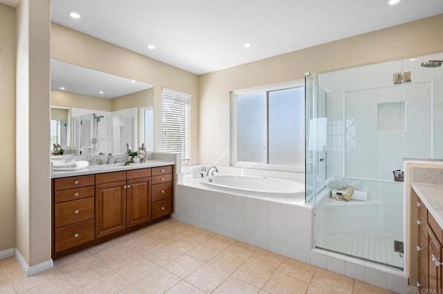 bathroom with vanity, tile patterned flooring, and separate shower and tub