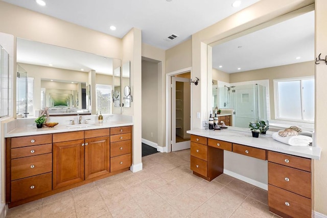 bathroom with vanity, tile patterned flooring, and walk in shower