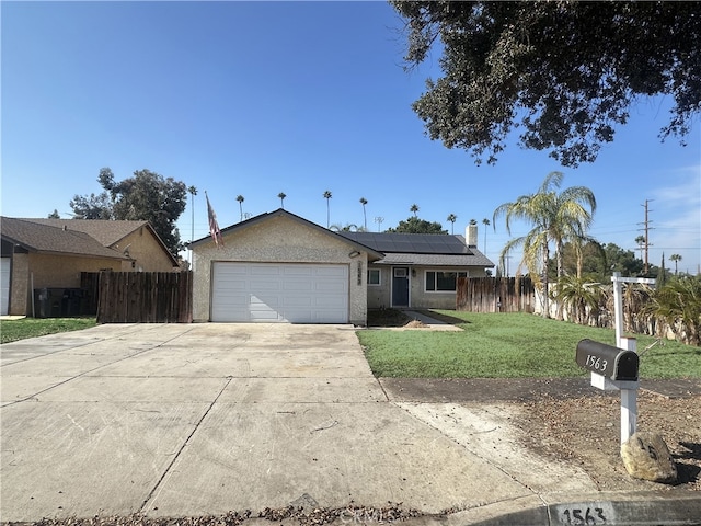 single story home with a garage, a front lawn, and solar panels