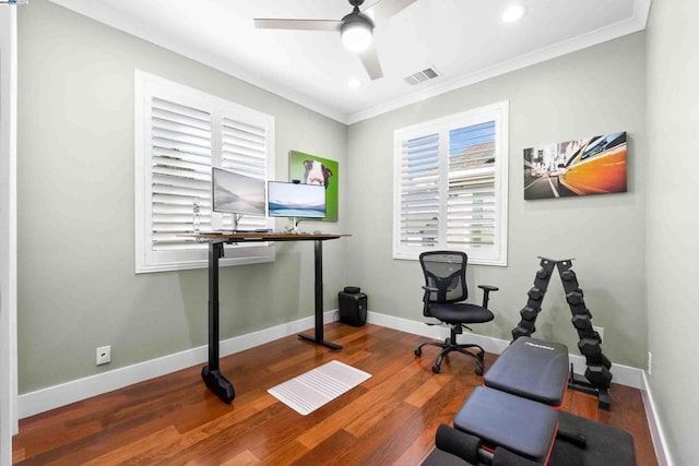 workout room with crown molding, ceiling fan, and hardwood / wood-style floors