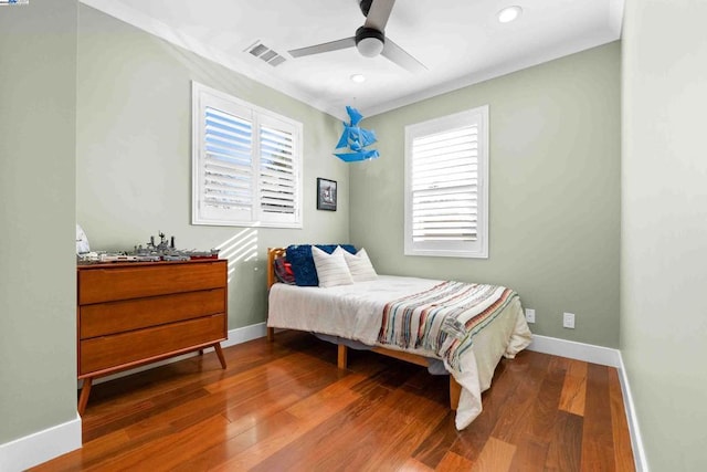 bedroom featuring hardwood / wood-style floors and ceiling fan