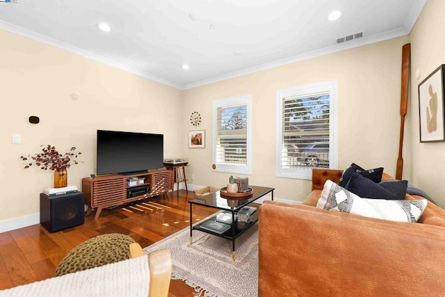 living room with crown molding and hardwood / wood-style floors